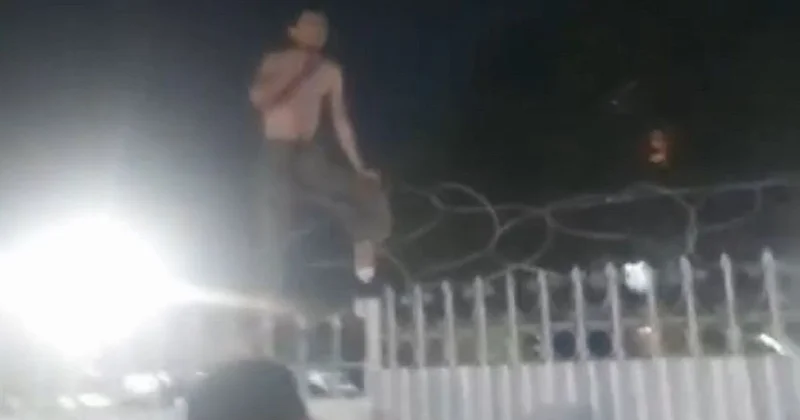 Видео жесткого задержания в Атырау: мужчина с кондиционера теперь забрался на забор
